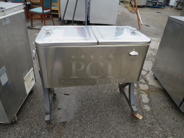 One Stainless Steel Cooler On Casters. 34X15X33