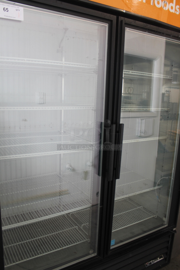 2011 True GDM-49F ENERGY STAR Metal Commercial 2 Door Reach In Freezer Merchandiser w/ Poly Coated Racks on Commercial Casters. 115/208-230 Volts, 1 Phase.  - Image 3 of 8