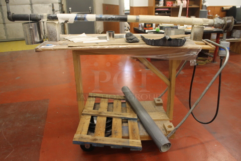 Wooden Table w/ Contents on Commercial Casters.