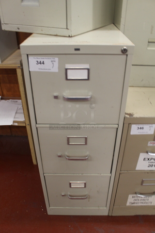Tan Metal 3 Drawer Filing Cabinet. BUYER MUST REMOVE.