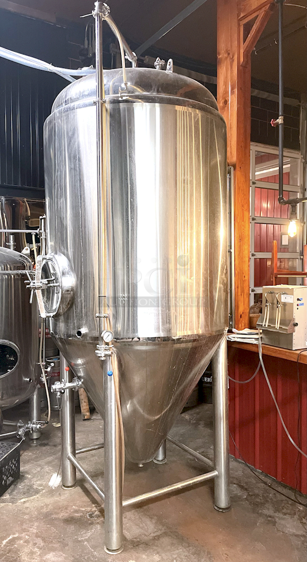 ? ?  BEAUTIFUL!! Stout Tanks & Kettles - 15 BBL Fermenter / Unitank (Jacketed). ? ?                 Features: Easily Converts to a Unitank or Brite Serving Tank;
Glycol Jacketed - 2 Zones: Cone and Sidewall; 
Shadowless Manway for Easy Cleaning;
Adjustable Racking Arm for Clear Transfer;
1.5" Sample Valve for Quality Testing;
Back Mounted Pressure Gauge;
Adjustable Feet for Leveling on Uneven Floors or Fine Height Adjustments;
Pressure Gauge Type:  Back Mount;
CIP Arm and 2.5" Rotating CIP Spray Ball;
2 Butterfly Valves;
Rated to 2-Bar (29 PSI);
1/2" NPT Welded Thermowell for Contactless Temperature Probe
Tank Thickness: 3mm
Jacket and Outer Shell Thickness: 2mm.
Cone: 60 degree Interior Angle.
51.5-in. diameter x 125-in.H. - Image 4 of 8