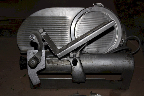 SOLID! Hobart 1612E Deli Slicer, Working When Tested Slice Thickness: 1 1/4". Knife Diameter: 11 3/4". Capacity: Food up to 12"W or 7 1/2" in diameter. Volts: 115. Hertz: 60. Single Phase. Amps: 4.5. Horse Power: 1/4; 23-5/8"W x 26-1/4"D x 21-1/4"H - Image 4 of 4