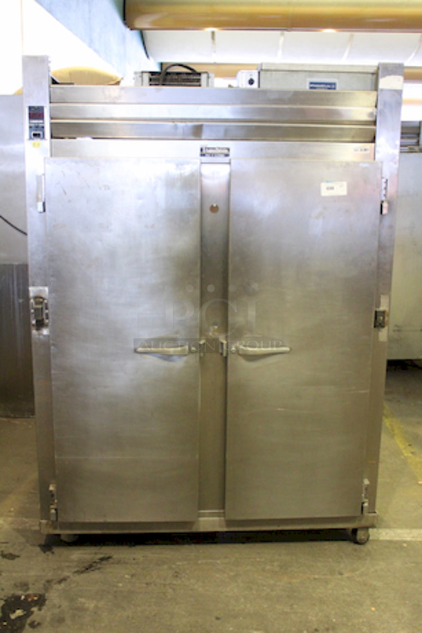 Traulsen RHT232WUT-FHS 58'' 51.6 cu. ft. Top Mounted 2 Section Solid Door Reach-In Refrigerator. Tested. Gets Cold. Racks Came Losing When Moving Down From 6th Floor. Can Be Re-Attached. 