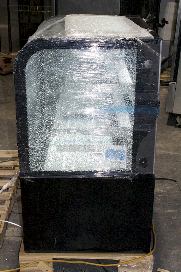 Avantco BC-36-HC 36" Curved Glass Black Refrigerated Bakery Display Case On Commercial 2" Casters With Adjust Glass Shelves & LED Lighting. Tested. Works Perfect. Exterior/Outer Glass is Damaged on Right Side. Interior Glass Is Fine. See Photos. - Image 3 of 5