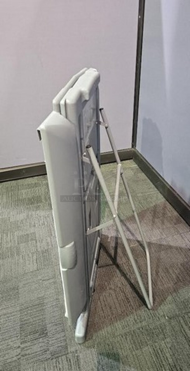 Quartet folding easel- gray in color. In good condition- minor scuffs and cosmetic marks from normal wear and tear. 44"H x 28"W x 18"D. 

  - Image 2 of 3