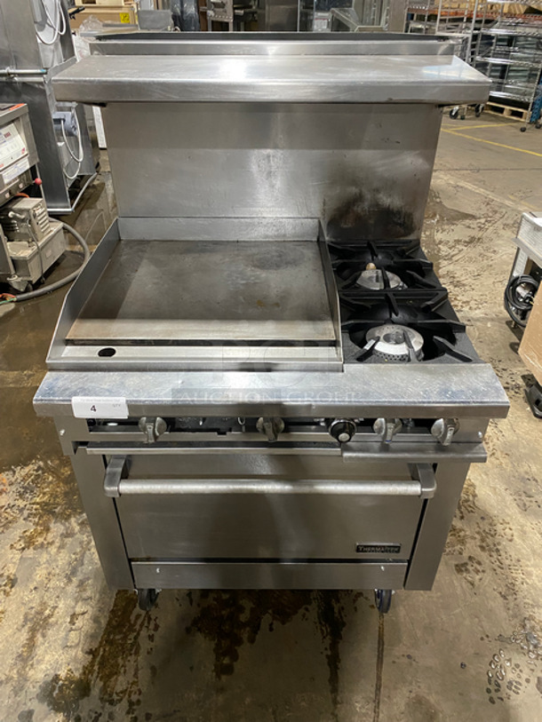 AMAZING! Therma Tek Commercial Natural Gas Powered Flat Top Griddle! With Right Side 2 Burners! Griddle Has Side Splashes! Raised Backsplash And Salamander Shelf! With Oven Underneath! Metal Oven Rack! All Stainless Steel! On Casters!
