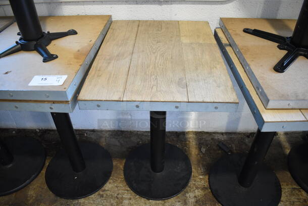 3 Wood Pattern Dining Height Tables on Black Metal Table Bases; 2 Have Broken Table Bases - See Pictures. 18x24x30. 3 Times Your Bid!