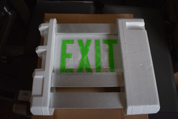 4 BRAND NEW IN BOX! Lithonia Lighting LRP 1 RC 120/277 PNL Exit Signs. Includes 12x2x10. 4 Times Your Bid!