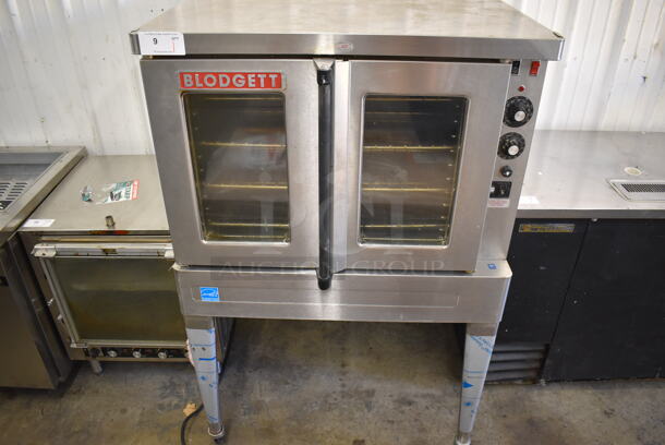 2019 Blodgett SHO-100-E ENERGY STAR Stainless Steel Commercial Electric Powered Full Size Convection Oven w/ View Through Doors, Metal Oven Racks and Thermostatic Controls on Metal Legs w/ Commercial Casters. 208-240 Volts, 1 Phase. 38.5x40x62