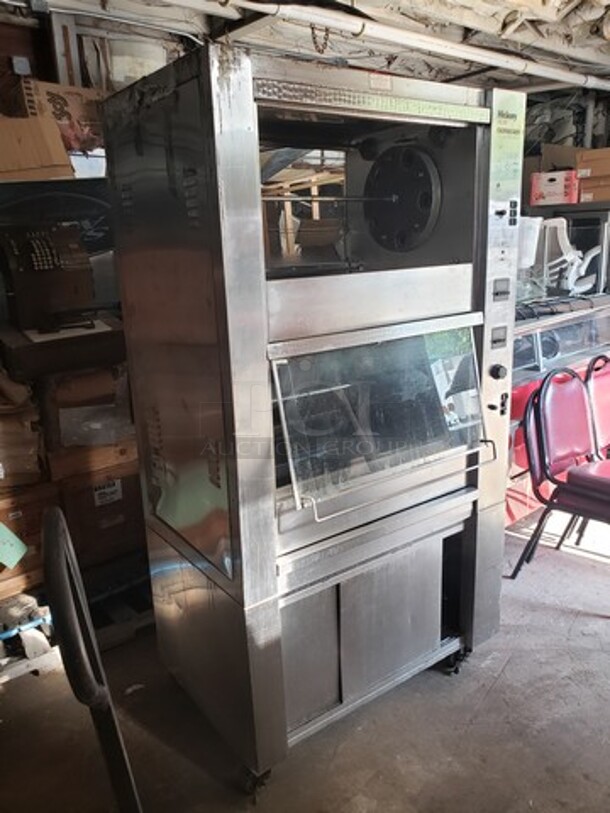 Hickory 10.10E Electric Rotisserie Oven on Casters! Left side of the oven has a small dent. Missing one knob and one knob is broken and needs to be replaced. 

Motor 120V, 1PH
Heating Elements 208V, 3PH - Image 1 of 10
