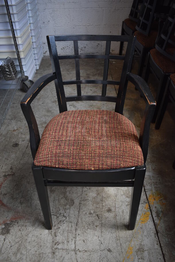 4 Black Wood Pattern Dining Chairs w/ Patterned Seat Cushion and Arm Rests. 20x18x33. 4 Times Your Bid!