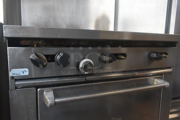 Garland SunFire Stainless Steel Commercial Natural Gas Powered 6 Burner Range w/ Oven and Back Splash on Commercial Casters.  - Image 4 of 8