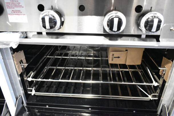 BRAND NEW! 2023 Garland G60-6G24CR Stainless Steel Commercial Floor Style Natural Gas Powered 6 Burner Range w/ Right Side Flat Top Griddle, 2 Ovens, Over Shelf and Back Splash. - Image 3 of 12