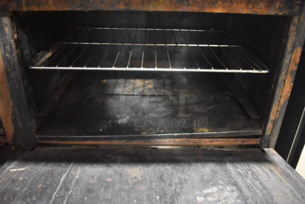 Imperial Commercial Stainless Steel Natural Gas Range With 10  Burners and 2 Ovens With Metal Racks On Commercial Casters.  - Image 6 of 7