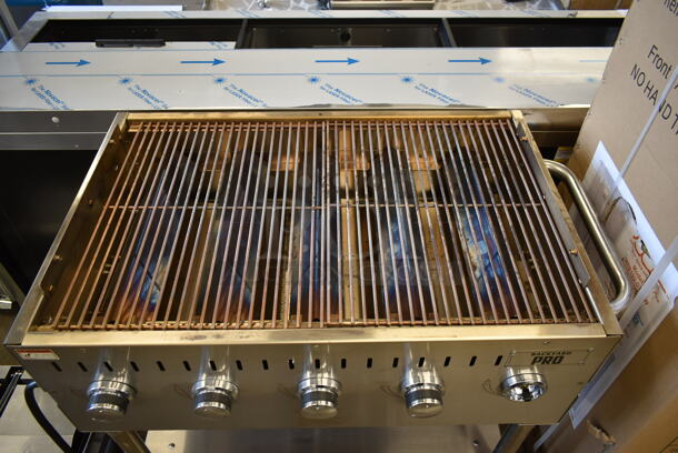 LIKE NEW! 2022 Backyard Pro 554LPG36 Stainless Steel Commercial Propane Gas Powered Outdoor Grill w/ Brick Oven Attachment and Under Shelf on Commercial Casters. Stock Picture Used as Gallery. Tested and Working! - Image 6 of 10