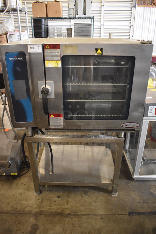 2014 Alto Shaam Model 7.14 ES Stainless Steel Commercial Electric Powered Combitherm Convection Oven w/ View Through Door and Metal Oven Racks on Equipment Stand. 208-240 Volts, 3 Phase. 45x44x61