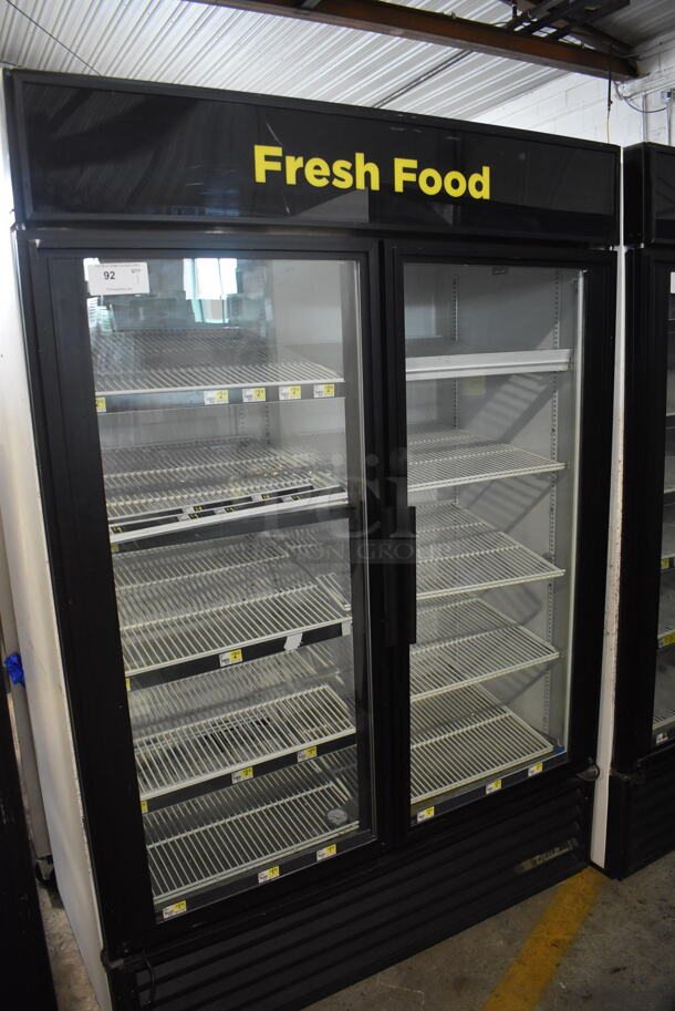 2011 True GDM-49 Two Section Reach-In Floor Standing Glass Door Merchandiser Cooler In Black With Polycoated Racks. 115V, 1 Phase. Tested And Working