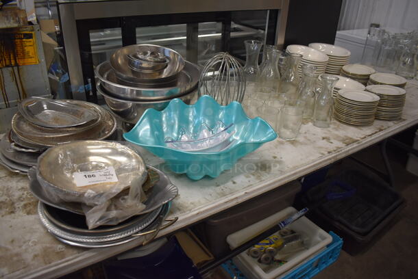 ALL ONE MONEY! Lot of Items on Tabletop Including Ceramic Plates, Glasses, Whisk Attachment and Metal Bowls.