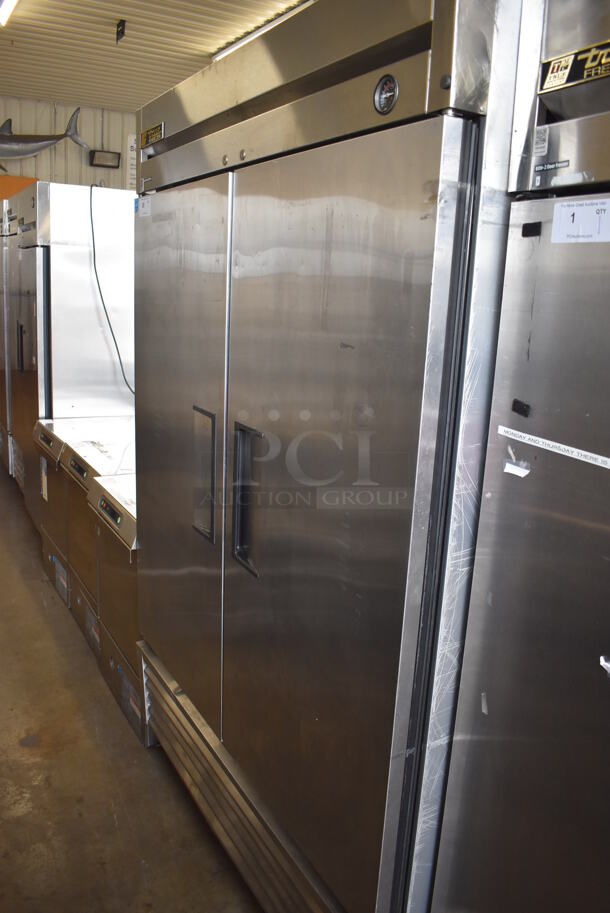 2013 True T-49F ENERGY STAR Stainless Steel Commercial 2 Door Reach In Freezer w/ Poly Coated Racks on Commercial Casters. 115 Volts, 1 Phase. 54x30x83. Tested and Working!