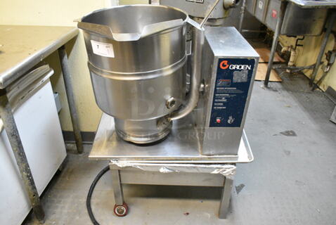 Groen TDB-40 Stainless Steel Commercial Electric Powered 40 Quart Tilting Steam Kettle on Equipment Stand w/ 2 Commercial Casters. 250 Volts. This Unit Was In Working Condition When the Restaurant Closed. (kitchen)