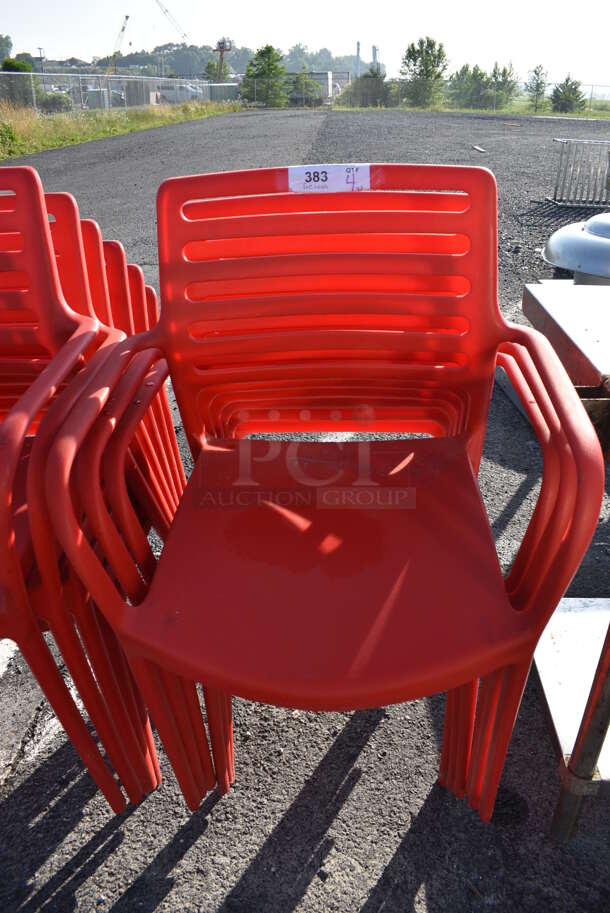 4 Red Poly Chairs w/ Arm Rests. 22.5x22x33. 4 Times Your Bid!