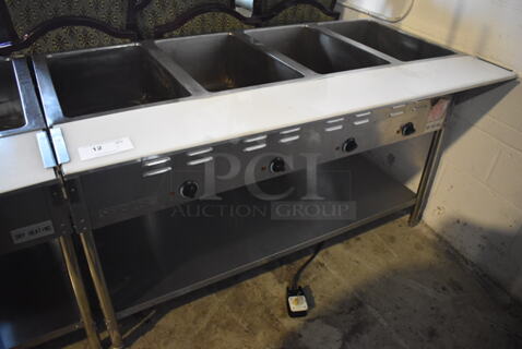 ServIt 423EST4WE750 Stainless Steel Commercial Electric Powered 4 Bay Electric Powered Steam Table w/ Cutting Board and Under Shelf. 208/240 Volts. 58x30x33