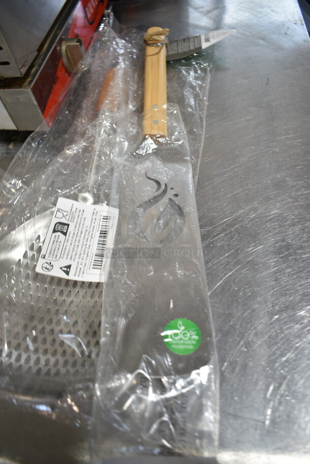 4 BRAND NEW SCRATCH AND DENT! Items Including 407TPD24RD Choice #24 Red Thumb Press Disher - 1.33 oz., 714QV12 Outset® QV12 18" Stainless Steel Ultra-Thin Slotted Turner with Bamboo Handle, Monin Syrup Pumps, Strainer. 4 Times Your Bid!  - Image 4 of 9