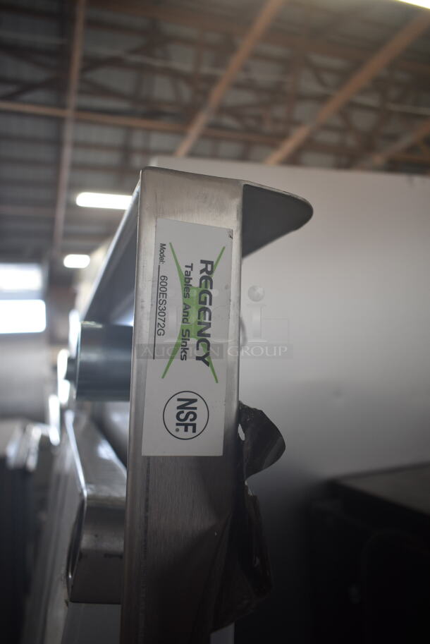 BRAND NEW SCRATCH AND DENT! Regency 600ES3072G 16-Gauge Stainless Steel Commercial Work Table with 4" Backsplash and Undershelf. Stock Picture Used as Gallery. - Image 6 of 7