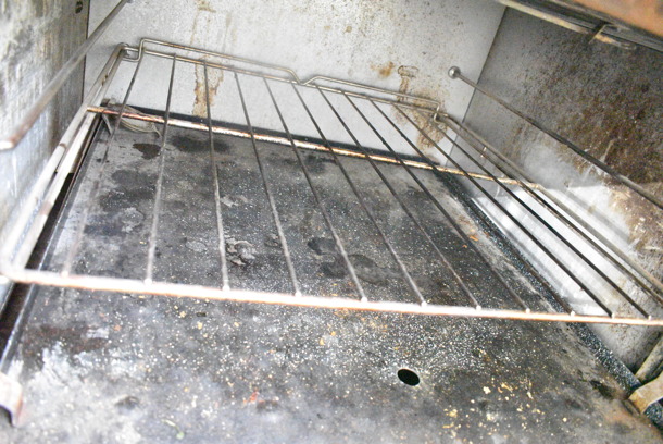 Southbend Stainless Steel Commercial Natural Gas Powered 6 Burner Range w/ Flat Top Griddle, 2 Ovens, Cheese Melter and Back Splash on Commercial Casters.  - Image 6 of 9