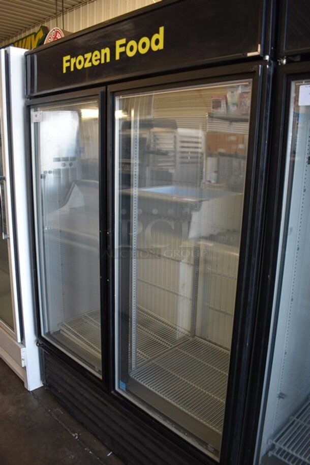 2013 True Model GDM-49F-LD Metal Commercial 2 Glass Door Reach In Freezer Merchandiser w/ Poly Coated Racks. 115/208-230 Volts, 1 Phase. 54x30x76.5.