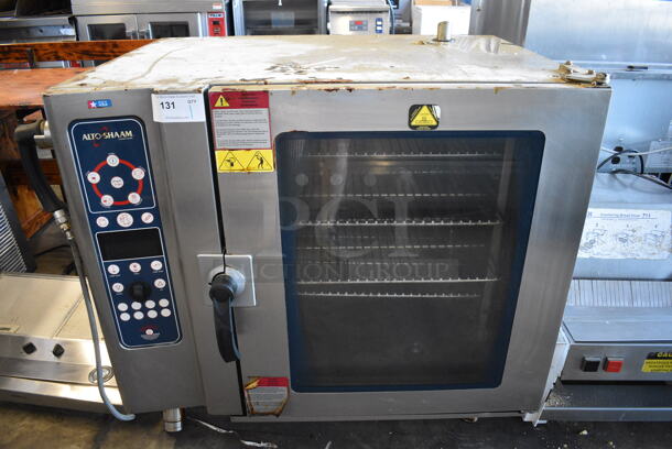 	2012 Alto Shaam Model 10.10 ES Stainless Steel Commercial Electric Powered Combitherm Convection Oven w/ View Through Door and Metal Oven Racks. 208-240 Volts, 3 Phase. 42x32x40