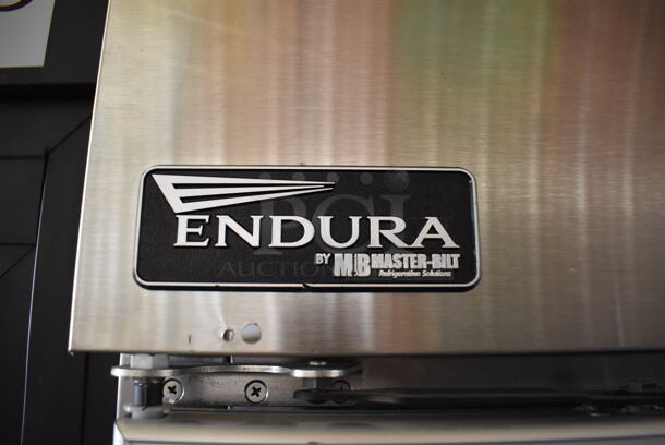 Master-Bilt Endura MNR803SSG/0X Stainless Steel Commercial 3 Door Reach In Cooler Merchandiser w/ Poly Coated Racks on Commercial Casters. 115 Volts, 1 Phase. 82.5x34x82. Tested and Working! - Image 2 of 7