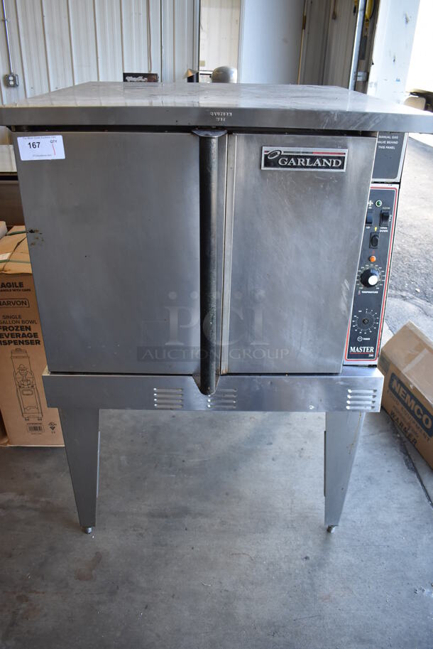 Garland Master 200 Stainless Steel Commercial Natural Gas Powered Full Size Convection Oven w/ Solid Doors, Metal Oven Racks and Thermostatic Controls on Metal Legs. 38x40x59
