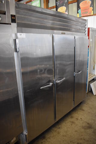 Traulsen G30010 Stainless Steel Commercial 3 Door Reach In Cooler w/ Metal Racks on Commercial Casters. 115 Volts, 1 Phase. 76x34x83. Tested and Working!