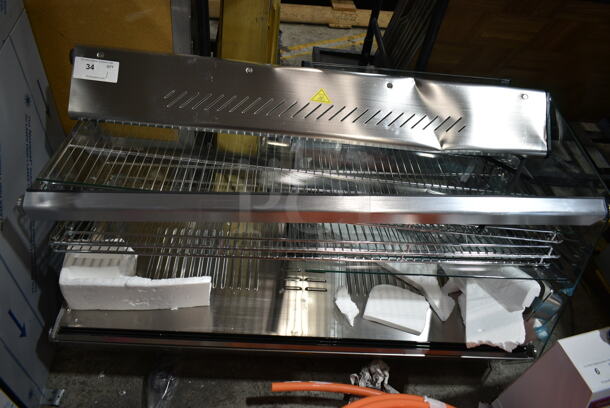 BRAND NEW SCRATCH AND DENT! ServIt 423HDM48SA Stainless Steel Commercial Countertop Full Service Heated Merchandiser Display Case. See Pictures for Damage. 120 Volts, 1 Phase. Tested and Working!
 - Image 1 of 7