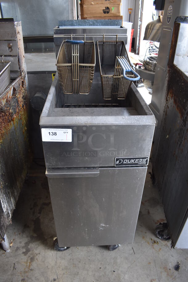 Dukers DCF4-NG Stainless Steel Commercial Floor Style Natural Gas Powered Deep Fat Fryer w/ 2 Metal Fry Baskets on Commercial Casters. 120,000 BTU.