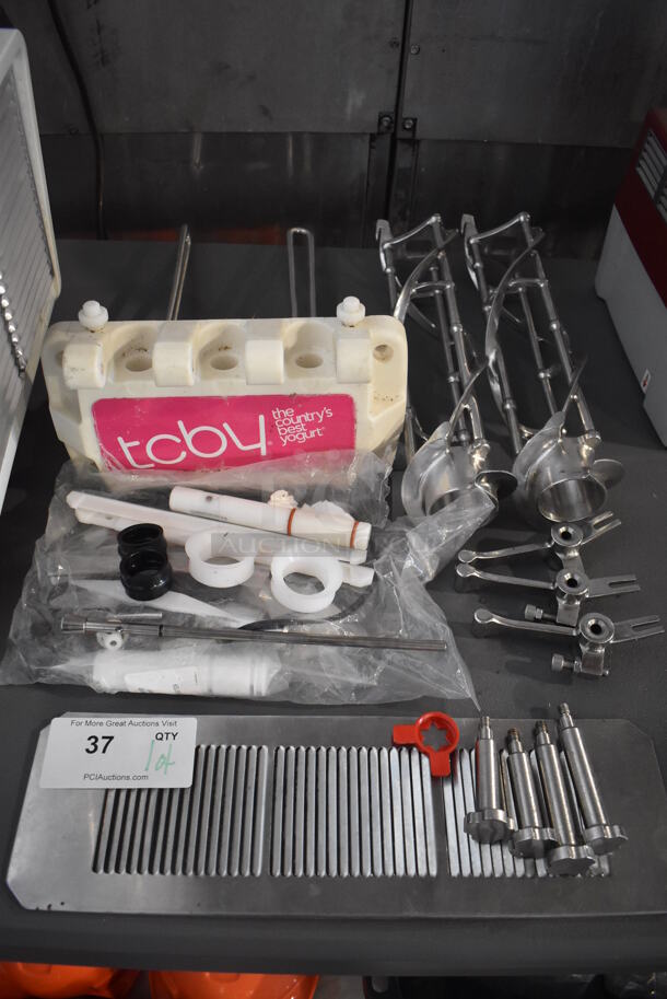 ALL ONE MONEY! Lot of Various Ice Cream Machine Parts Including Front Piece, 2 Augers, Drip Tray Grate, 4 Knobs and 3 Handles - Image 1 of 5