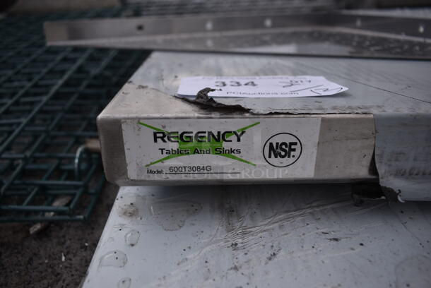 BRAND NEW SCRATCH AND DENT! Regency 600T3084G 30" x 84" 18-Gauge 304 Stainless Steel Commercial Work Table with Galvanized Legs and Undershelf - Image 4 of 5