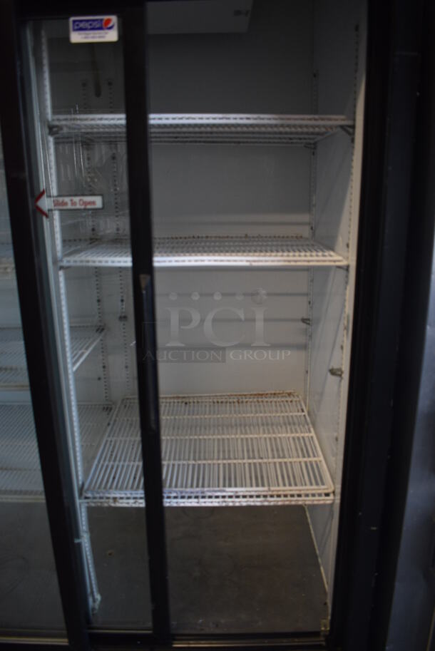 True Model GDM-45 Metal Commercial 2 Door Cooler Merchandiser w/ Sliding Doors and Poly Coated Racks on Commercial Casters. 115 Volts, 1 Phase. 51.5x31x82.5. Tested and Working! - Image 6 of 6