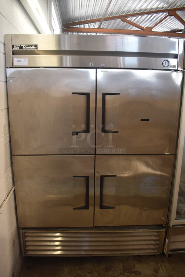 True T-49-4 Stainless Steel Commercial 4 Half Size Door Reach In Cooler w/ Poly Coated Racks on Commercial Casters. 115 Volts, 1 Phase. Tested and Working!