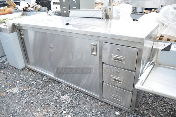 BRAND NEW SCRATCH AND DENT! Regency 600EBT2472R 24" x 72" 16 Gauge Type 304 Stainless Steel Enclosed Base Sliding Door Table with Drawers - Image 2 of 6