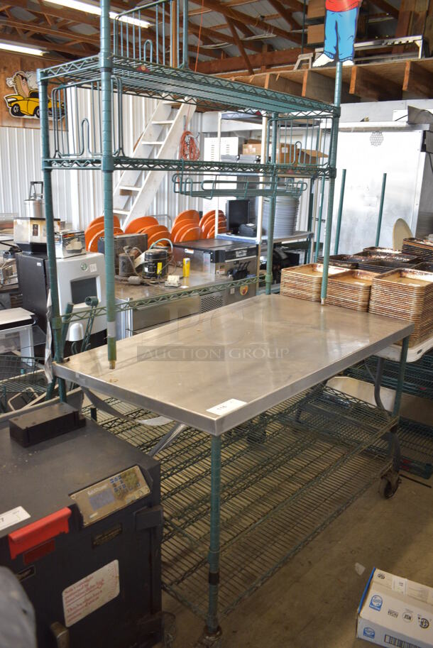 Metal Table w/ 2 Wire Under Shelves and 2 Over Shelves on Commercial Casters. 48x30.5x75
