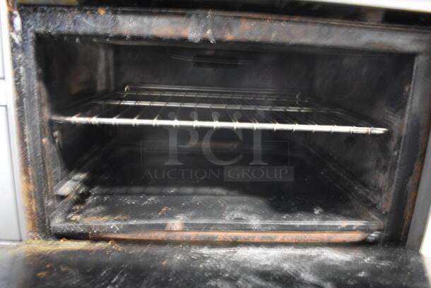 Imperial Stainless Steel Commercial Natural Gas Powered 4 Burner Range w/ Flat Top Griddle, 2 Ovens, Over Shelf and Back Splash. 60x32x55 - Image 7 of 7