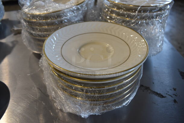 41 White Ceramic Saucers w/ Gold Finish Line on Rim. 5.75x5.75x1. 41 Times Your Bid!
