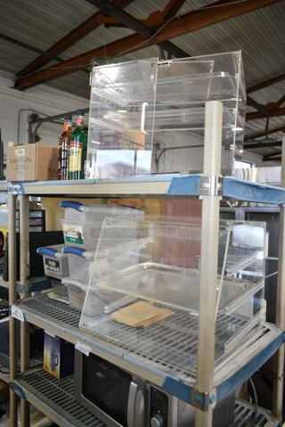 ALL ONE MONEY! Two Tier Lot of Various Items Including 2 Clear Poly Dry Display Cases, 4 Clear Poly Bins, Flavor Syrup Bottles, Ginger Peach Teabags. 