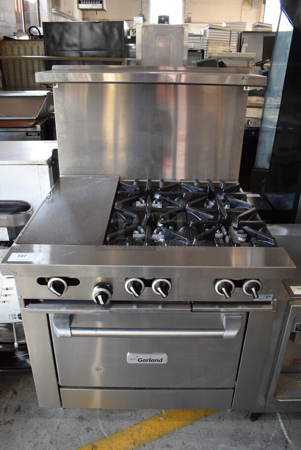 BRAND NEW! Garland Stainless Steel Commercial Natural Gas Powered 4 Burner Range w/ Flat Top Griddle, Oven, Over Shelf and Back Splash. 36x35x58