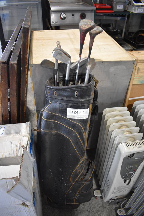 Black Golf Bag w/ 7 Various Golf Clubs. 9x9x46