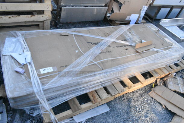 BRAND NEW SCRATCH AND DENT! Regency 600WT30X96BS 30" x 96" 16-Gauge 304 Stainless Steel Commercial Open Base Work Table with 4" Backsplash. May Be Missing Pieces.  - Image 2 of 3