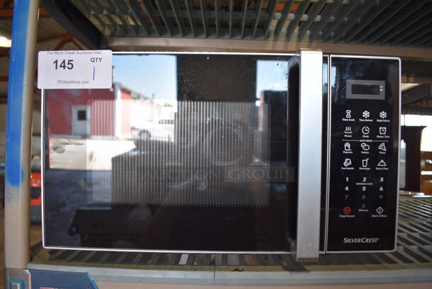 SilverCrest Model SMW 900 B1 Countertop Microwave Oven w/ Plate. 120 Volts, 1 Phase. 19x15x11