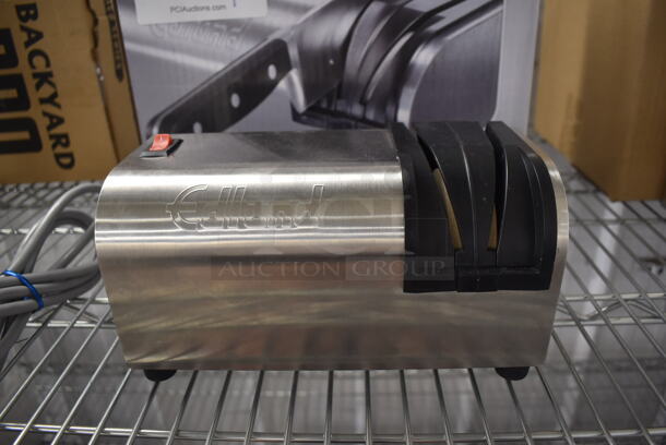 BRAND NEW IN BOX! Edlund 395 Stainless Steel Countertop Electric Powered Knife Sharpener with Guides. 115 Volts, 1 Phase. 9x4x5. Tested and Working!
